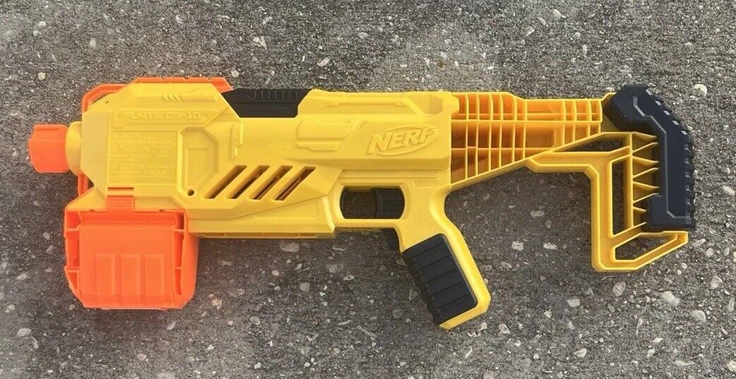 Box of Nerf Guns, Toys, and Accessories