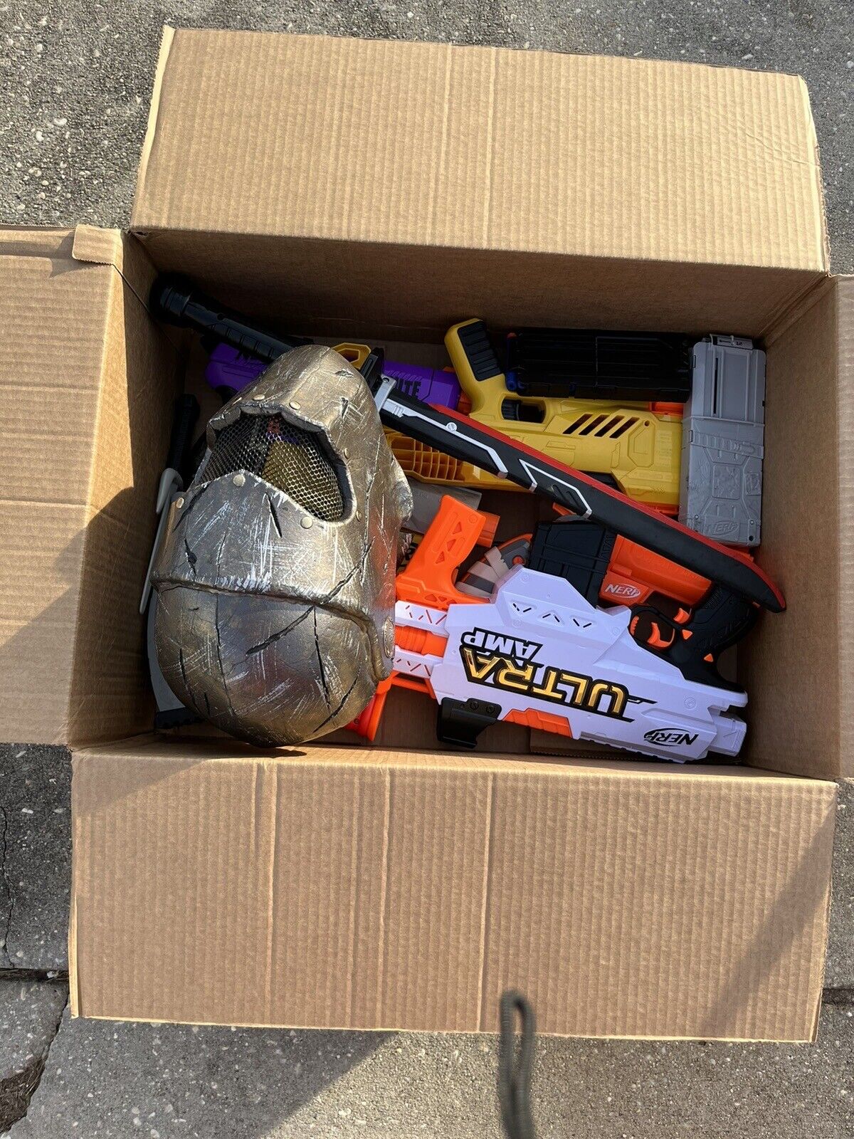 Box of Nerf Guns, Toys, and Accessories