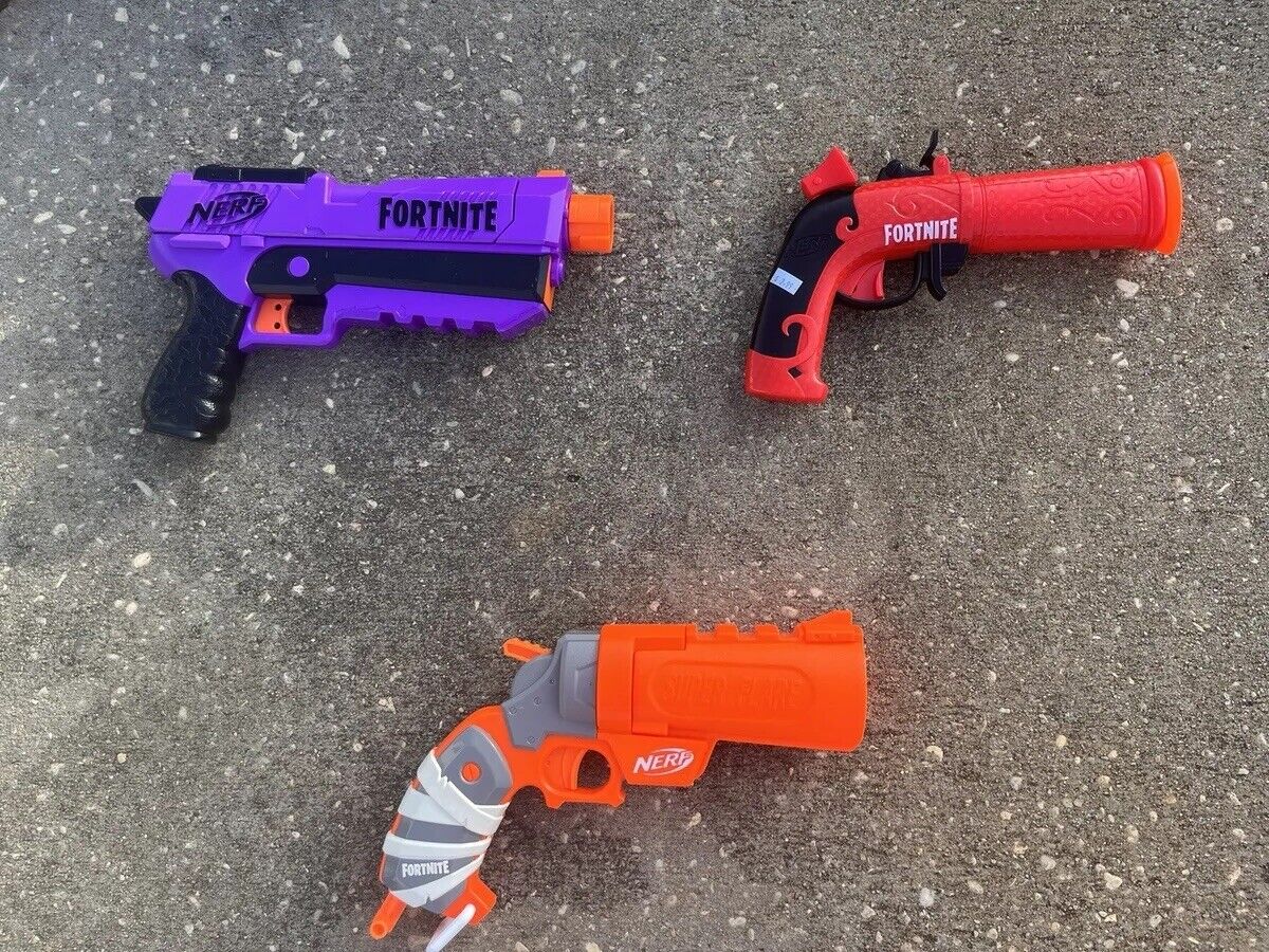 Box of Nerf Guns, Toys, and Accessories