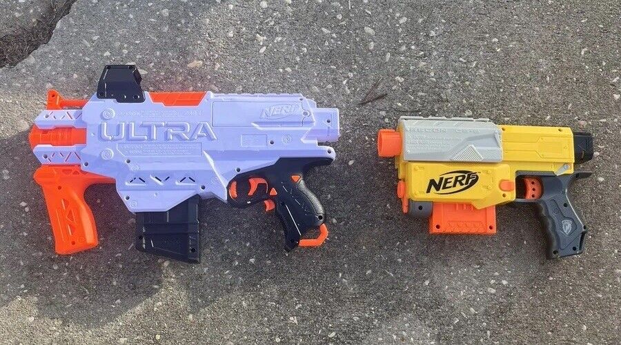 Box of Nerf Guns, Toys, and Accessories