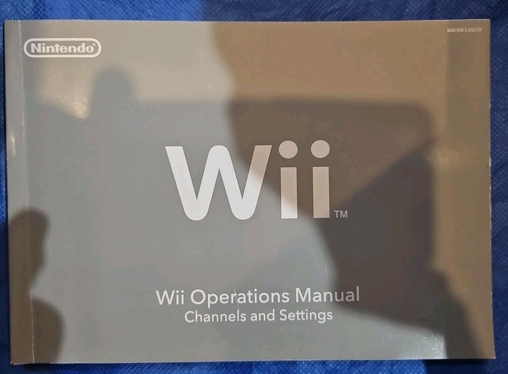 Wii Operations Manual (Soft Cover) In English, French & Spanish
