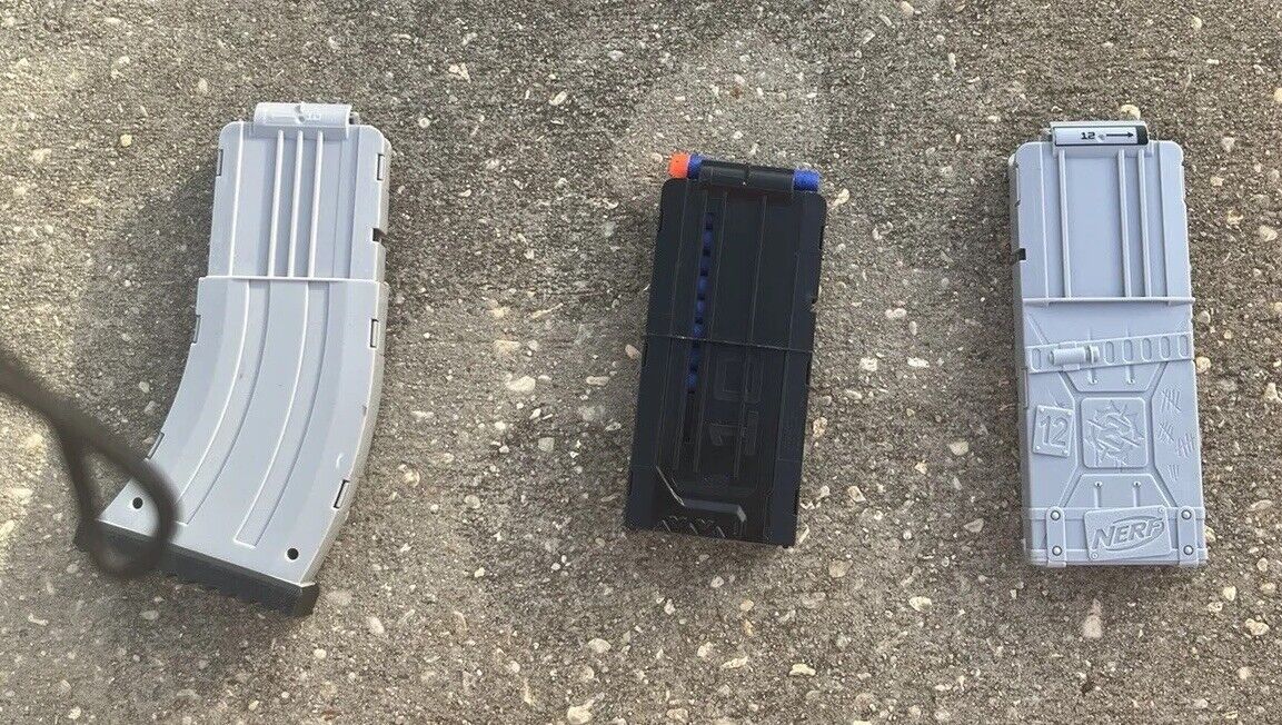 Box of Nerf Guns, Toys, and Accessories